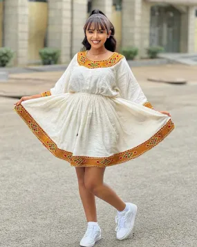 Breezy Habesha Chic: Embracing the Essence of Summer in a Short Ethiopian Kemis