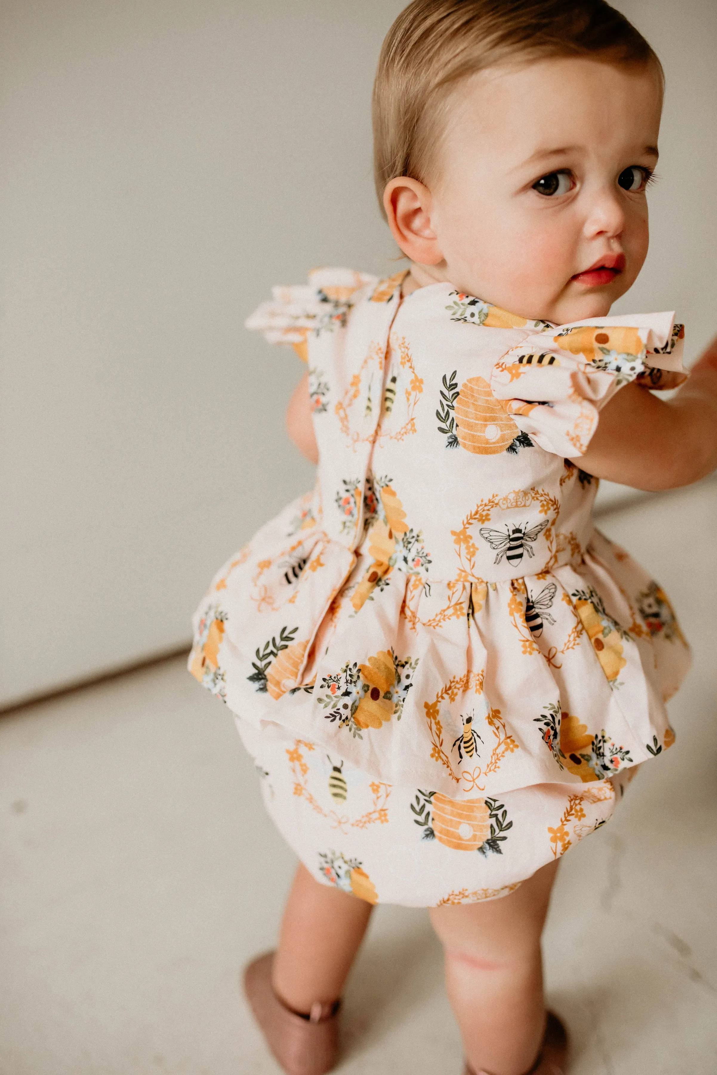 Infant Girl's Bee Print Peplum Bubble Romper