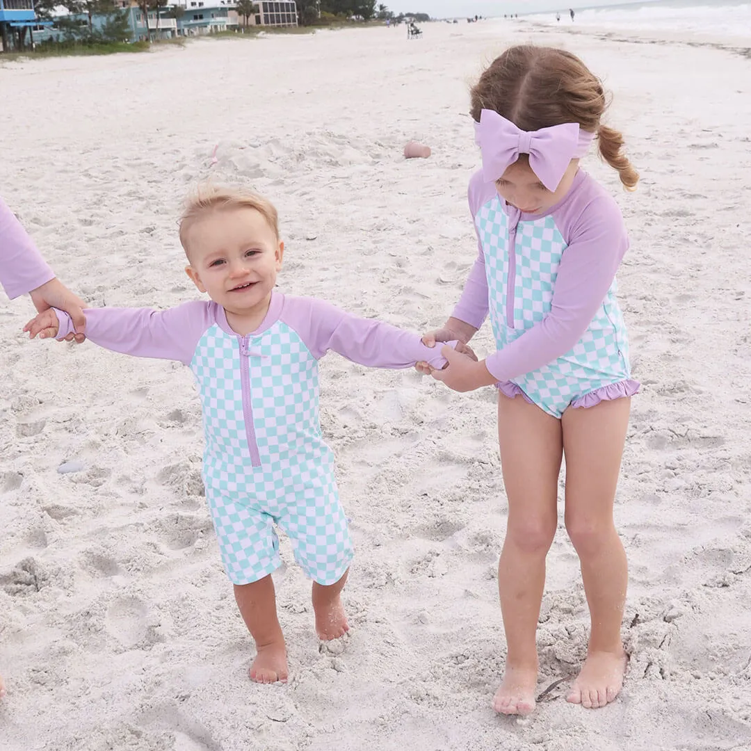 Long Sleeve Rash Guard Swim Romper Shortie | All Checked Out